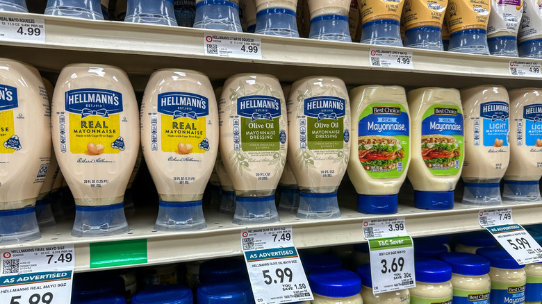 Squeezy mayonnaise bottles on supermarket shelf