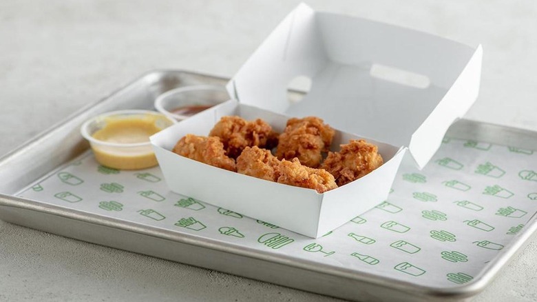 Chicken pieces in paper carton