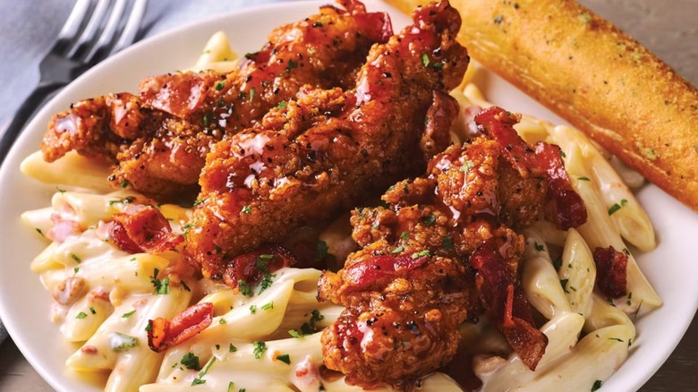 Applebee's mac and cheese and chicken tenders on a plate