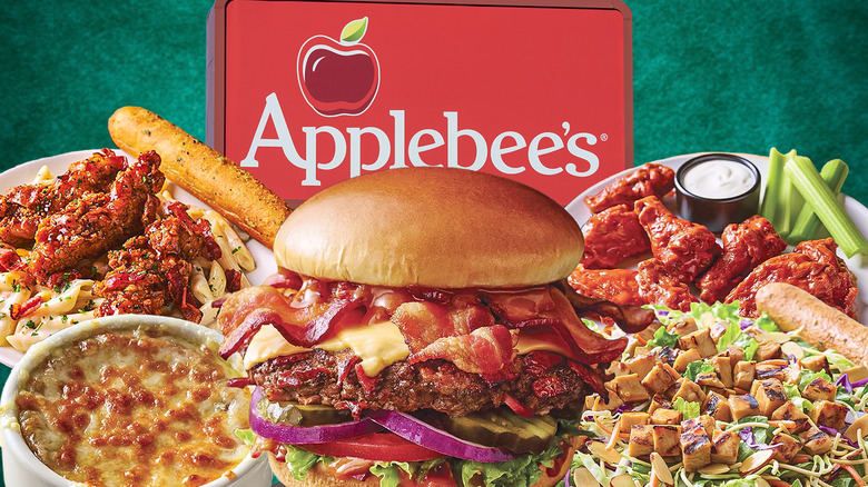 Assortment of Applebee's dishes in front of Applebee's sign