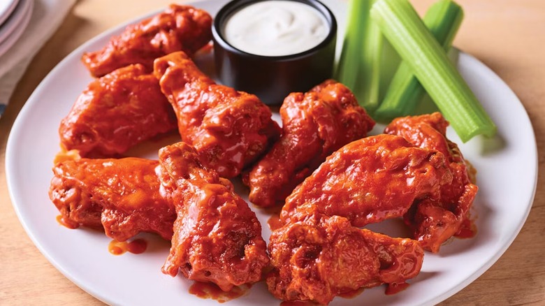 Platter of Applebee's chicken wings with ranch and celery