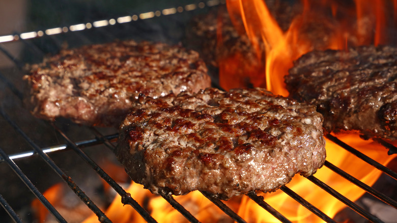 burger patties on grill