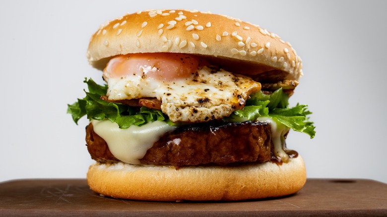 hamburger on bun with egg