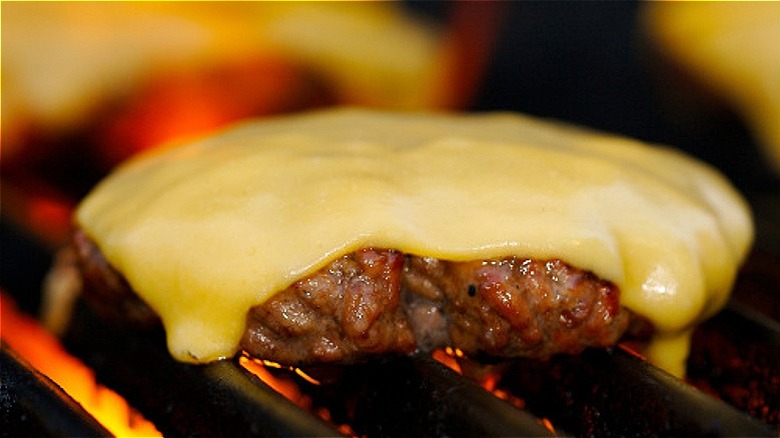 cheeseburger on grill