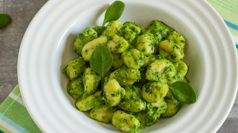 white bowl of spinach gnocchi 