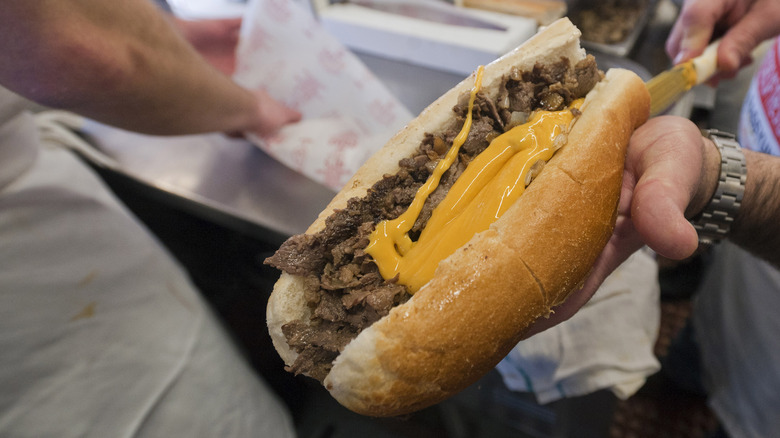 Holding Philly cheesesteak