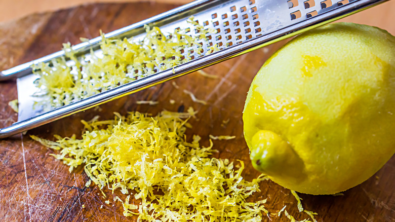 whole lemon with zester and zest