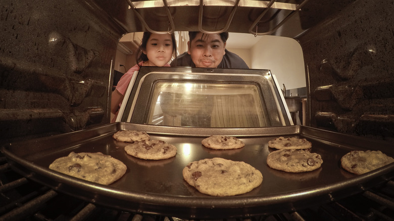 watching cookies in oven