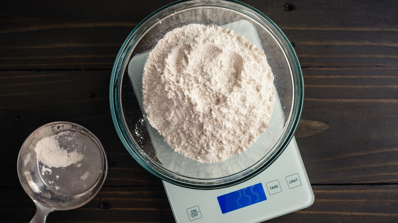 weighing flour in bowl on kitchen scale