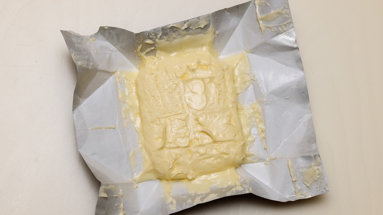 softened butter in wrapper on counter