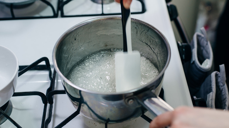 Sugar and water in pot