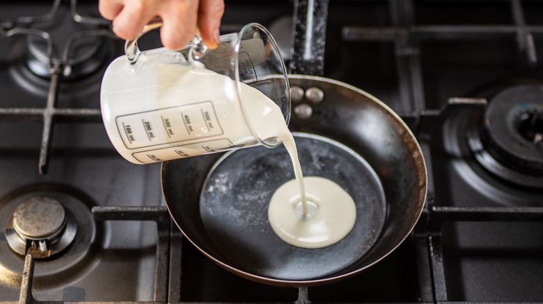 Pouring cream into pan