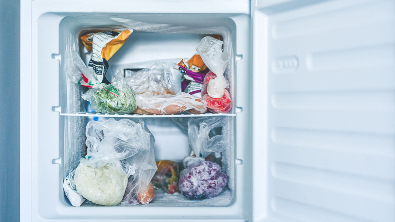 Freezer full of plastic bas