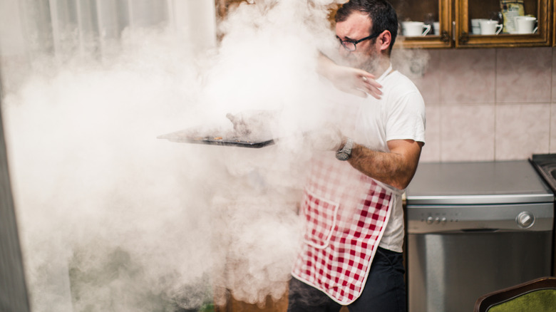 man burned meat in oven