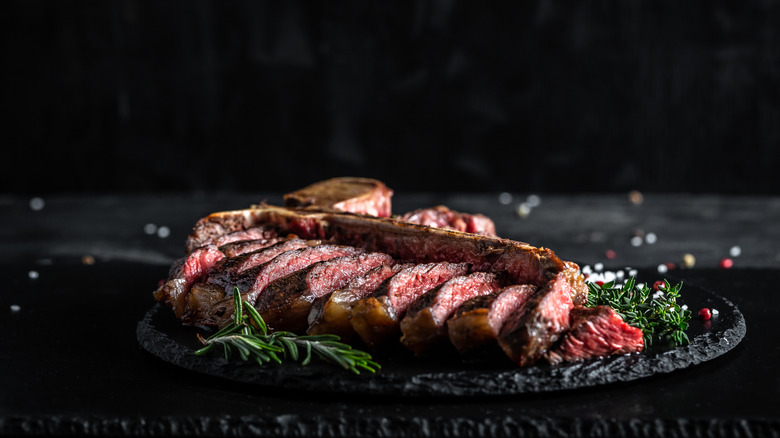 Cooked steak on black dish