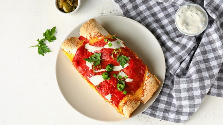 Neatly rolled enchiladas on plate