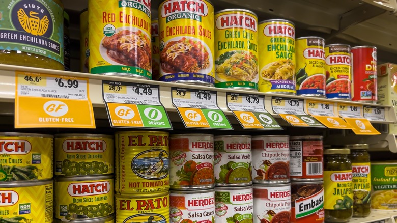 Canned enchilada sauces on shelf