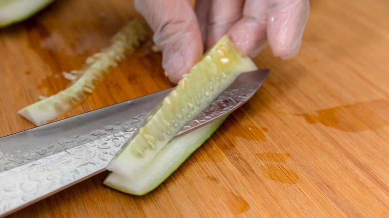 removing cucumbers seeds with knife