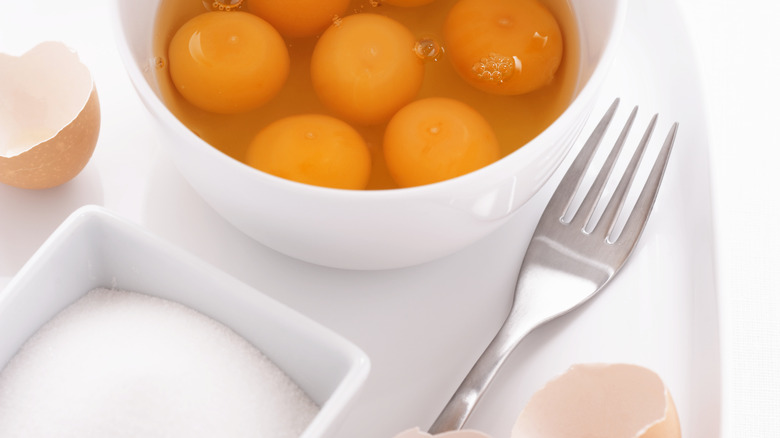 Raw eggs and sugar bowls