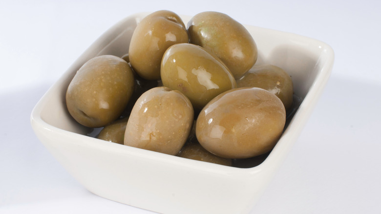 Manzanilla olives in a white bowl