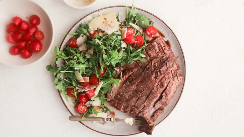 Beef Tagliata dish with salad