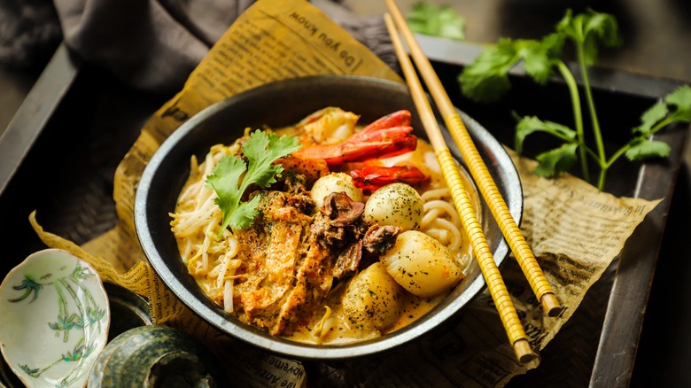 bowl of laksa with chopsticks