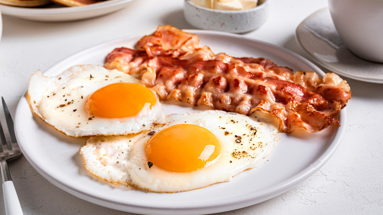 Fried eggs and bacon on a plate