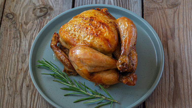 Whole roast chicken on a plate