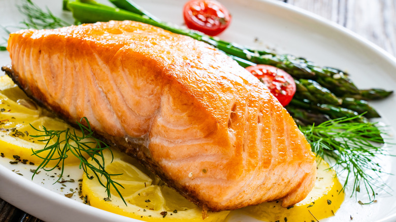 Baked salmon on a plate with asparagus