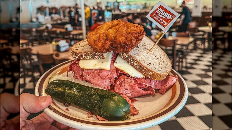 Manny's sandwich, pickle, and cafeteria