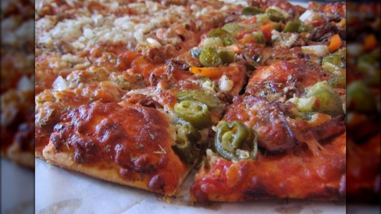 Thin crust pizza with peppers