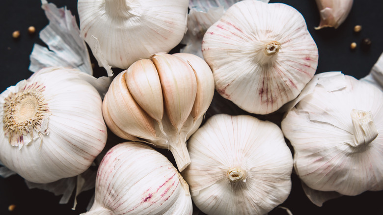 Garlic bulbs on black background