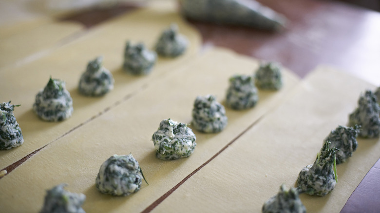 Homemade tortellini or ravioli being made