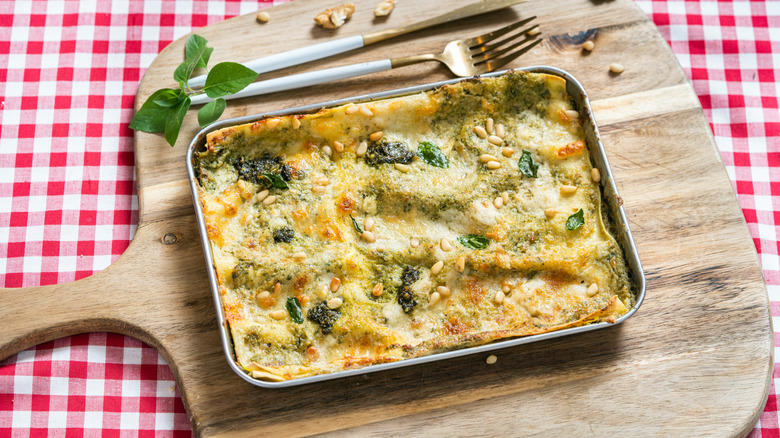 Pan of vegetable lasagna on a checkered tablecloth