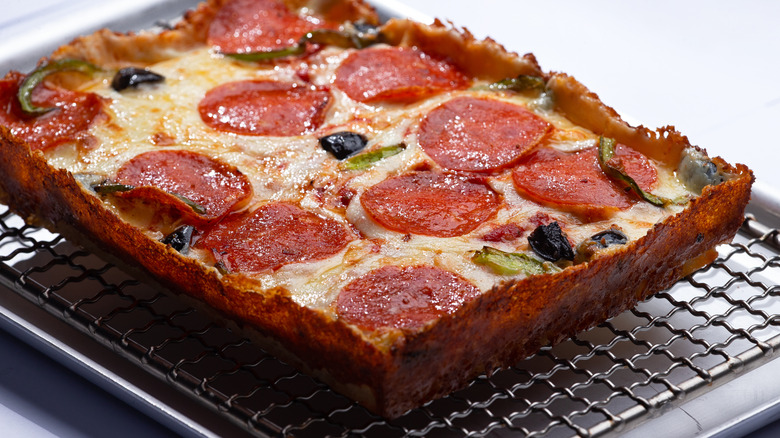 Detroit-style pizza on rack