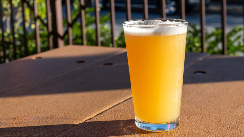A glass of IPA on a table