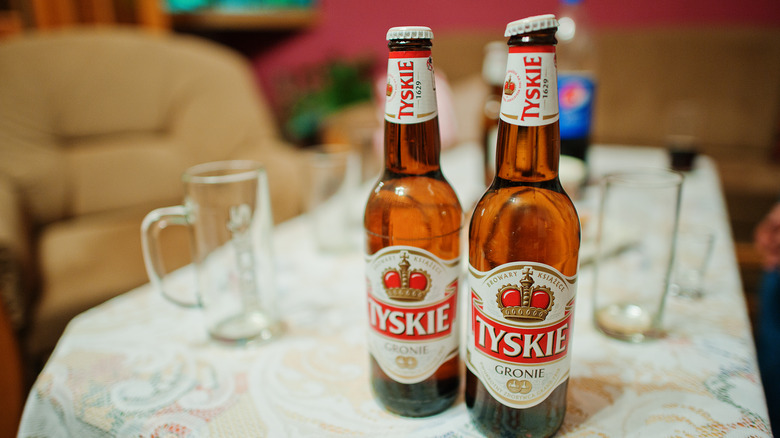Two bottles of Tyskie Gronie beer