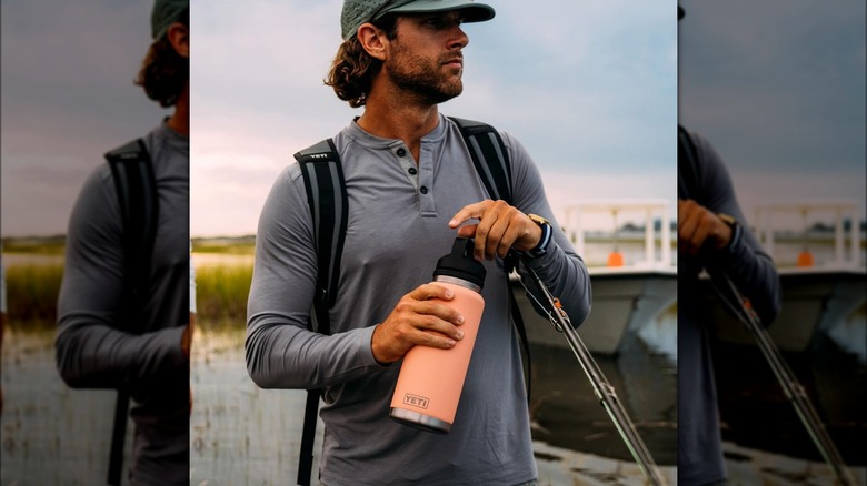 Man holding pink Yeti Rambler