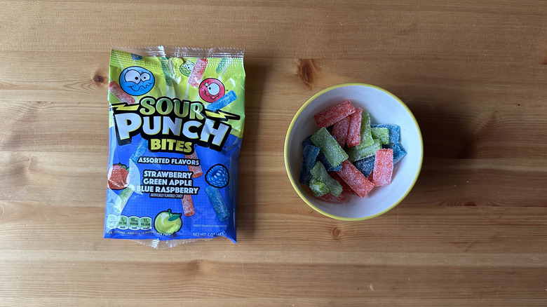 Sour Punch Bites bag with bowl on wooden table