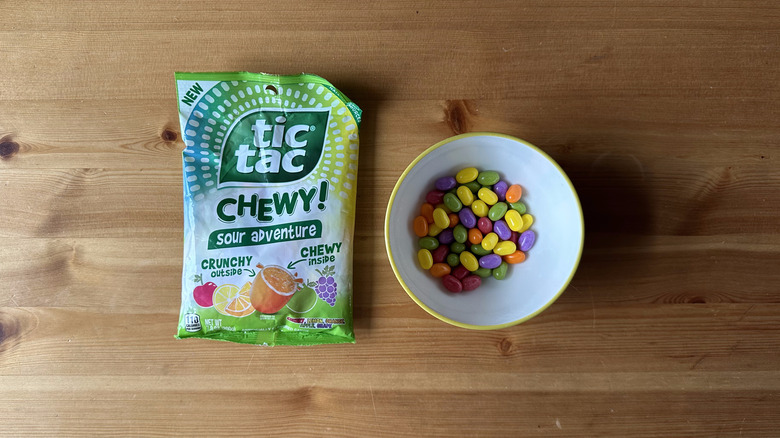Tic Tac Chewy Sour Adventure bag with bowl on wooden table