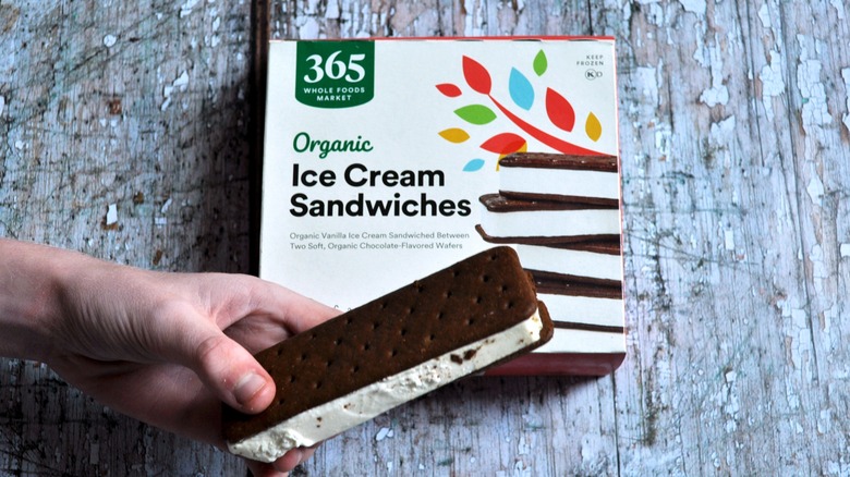 Hand holding ice cream sandwich