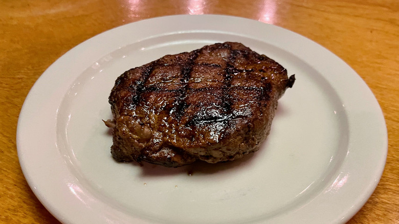 Grilled sirloin steak on plate