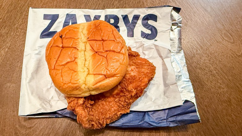 Zaxby's signature chicken sandwich on foil wrapper