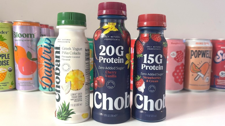 Three Chobani yogurt drinks lined up on white table