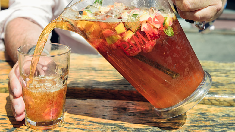 pitcher and glass of pimms with fruit 