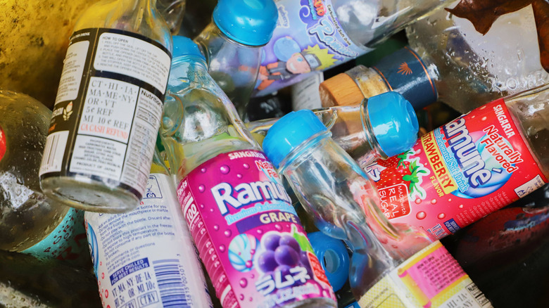 All the bottles of empty ramune in a bin