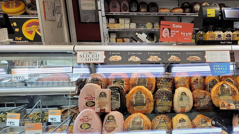 Deli counter filled with meats and other prepared foods