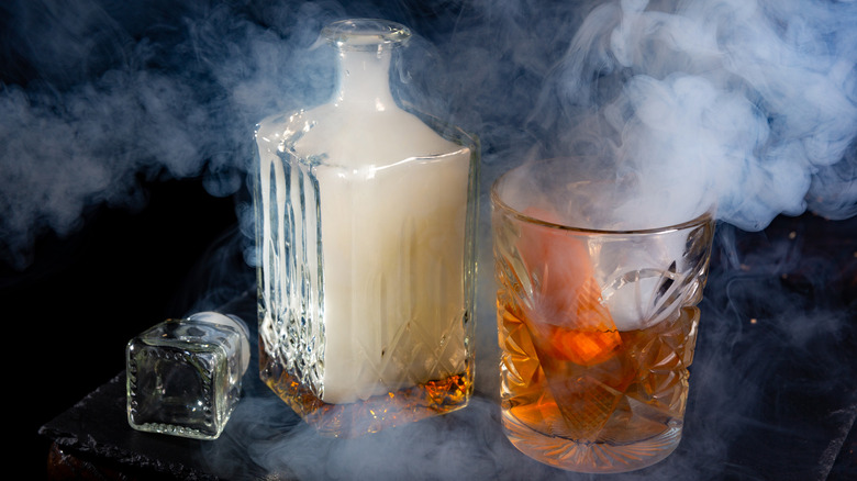 a smoking whisky glass and decanter