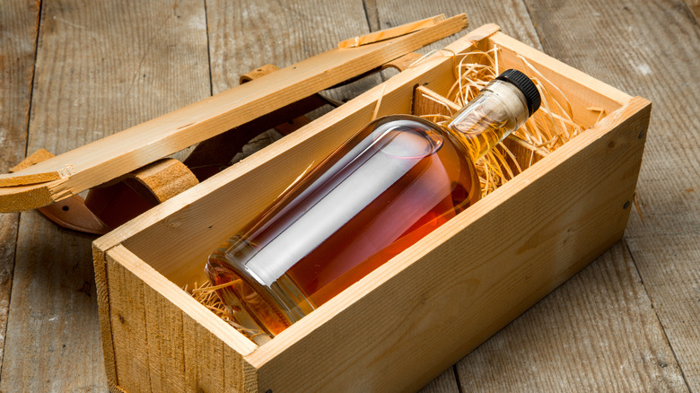 a whisky bottle in a wooden case