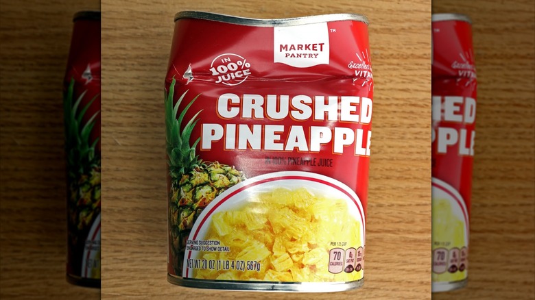 Dented can of crushed pineapple